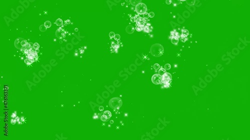 An animation of bubbles popping against the green background in 4K photo