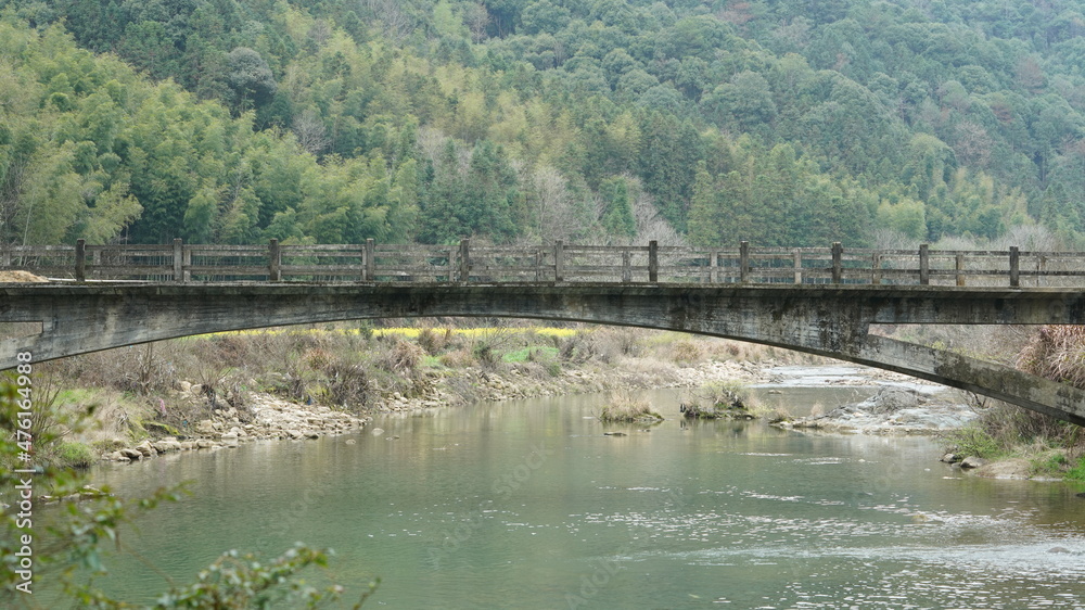 The old arched stone bridge made many years ago in the countryside of the China