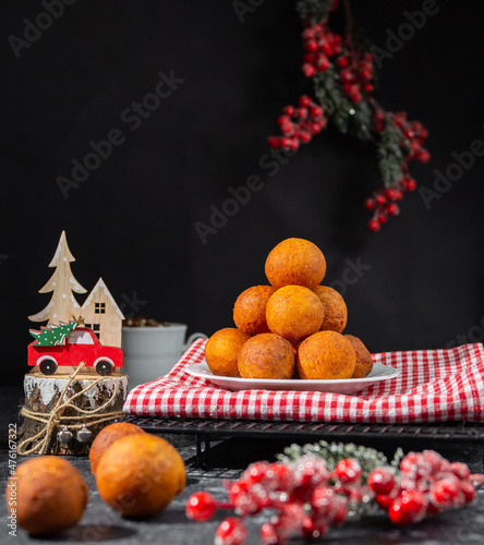 small balls of round doughnuts with christmas decorations