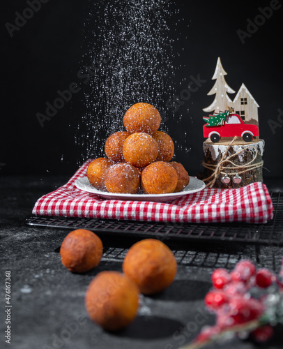 powdered sugar is poured onto delicious curd balls