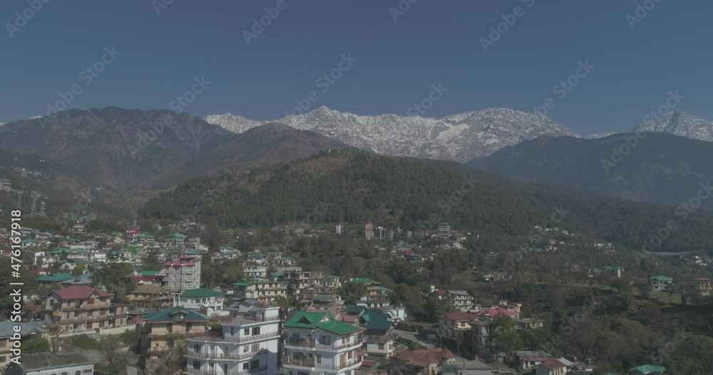 Establishing the Indian Himalayas and a quaint tourist town on the foothills with its sprawling residential buildings as the tourism attracts more and more travelers. Establishing the Indian Himalayas and a quaint tourist town on the foothills with its sprawling residential buildings as the tourism attracts more and more travelers.