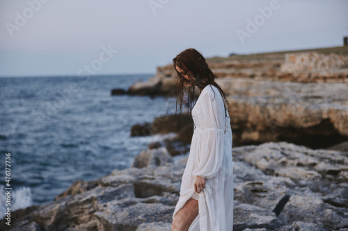 pretty woman in white dress landscape ocean side view unaltered