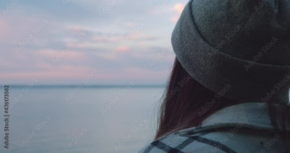 Close up of woman in hat admiring sunset on beach. Dolly left Close up of woman in hat admiring sunset on beach. Dolly left