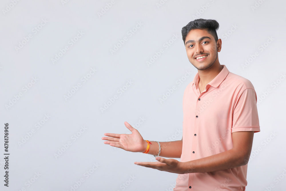 Young indian man giving expression on white background. Young indian man giving expression on white background.