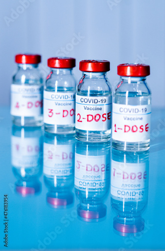 multiple doses of covid-19 or coronavirus vaccines on table for vaccination to protect againt coronavirus mutated variants or to stop pandemic