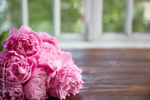 Flowers in close-up on a wooden surface. A place for a product or text