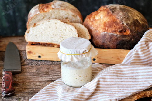 Bread sourdough in a glass jar. Side view, horizontal photo