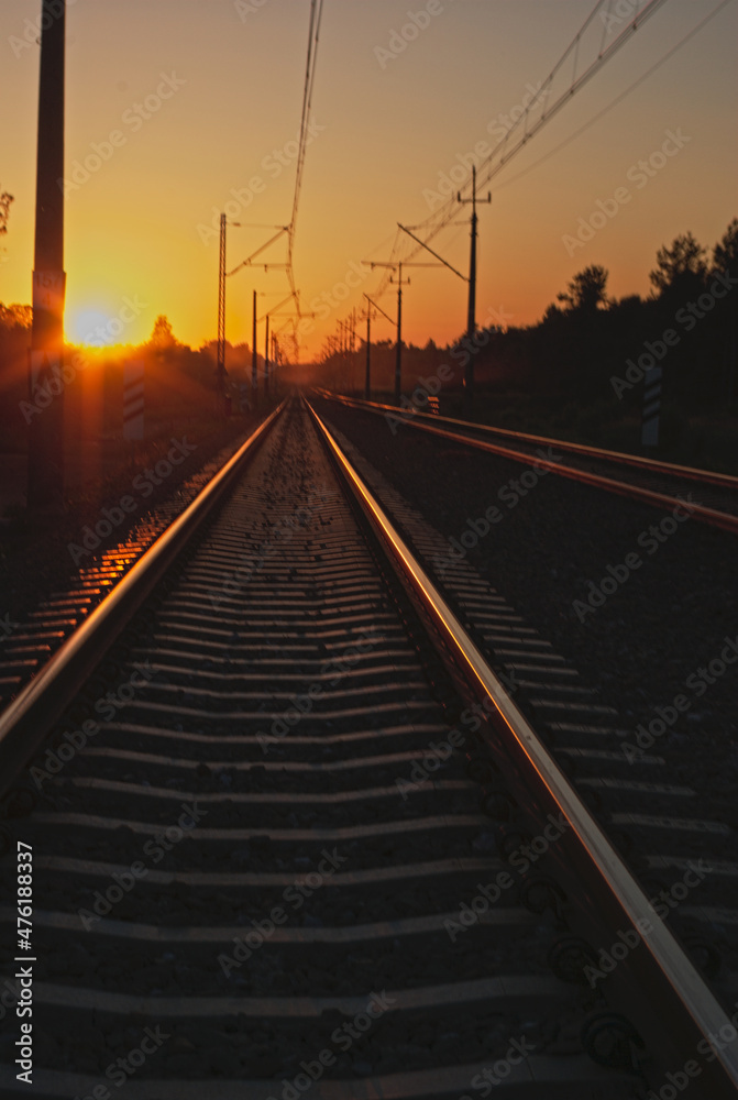 railroad tracks at sunset in the mountains