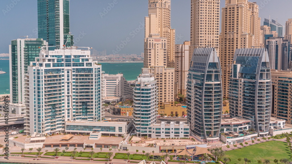 Dubai Marina skyscrapers and JBR district with luxury buildings and resorts aerial timelapse