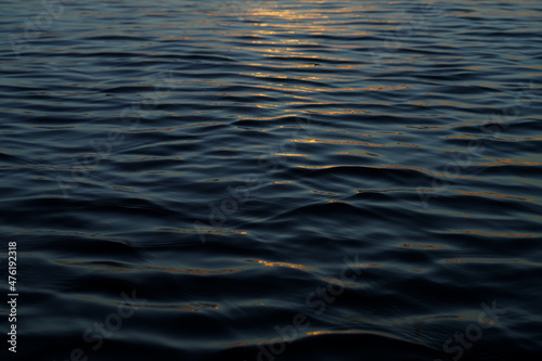 Close up water surface of the wave with soft sunlight.