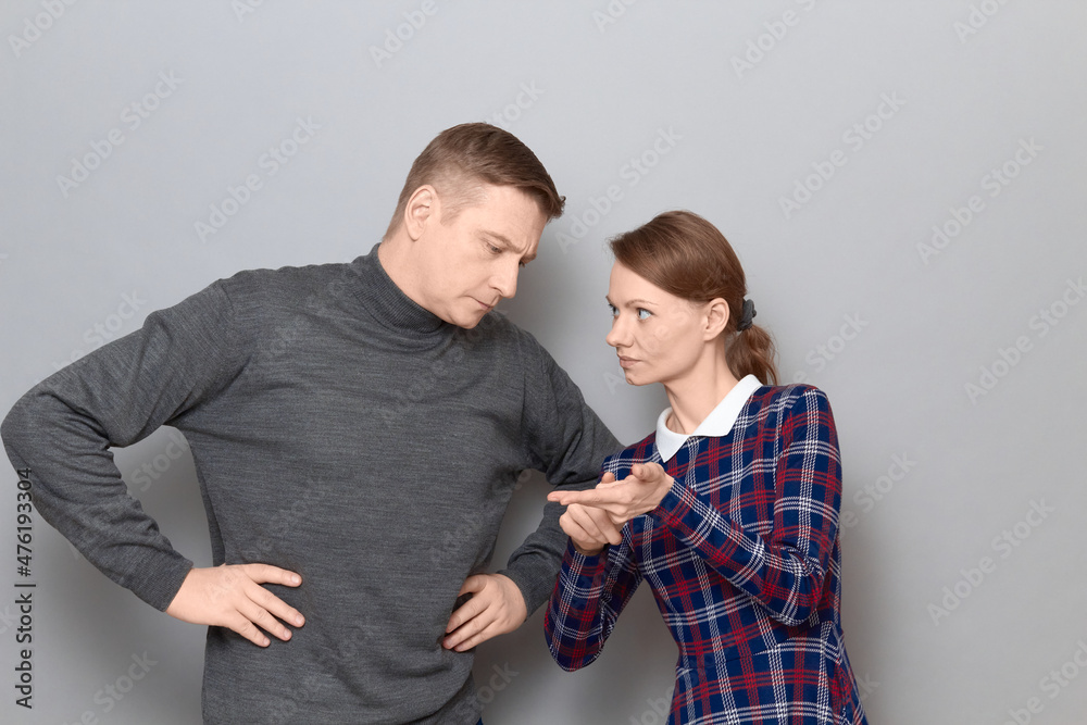 Portrait of man and woman talking and arguing, relationship concept Portrait of man and woman talking and arguing, relationship concept