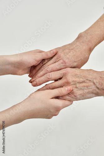 Cropped of grandma and granddaughter holding hands