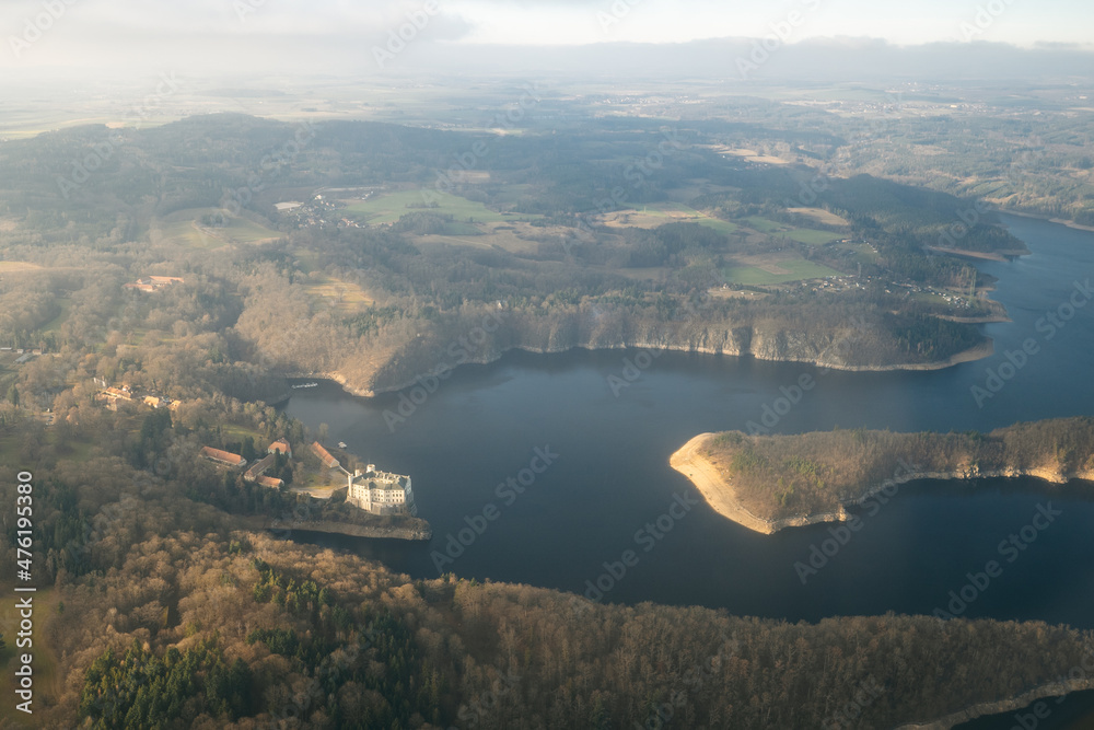 Beautiful aerial view of countryside during sunset from a Plane window Orlik Reservoir on Vltava River is largest hydroelectric dam in Czech Republic. Important source of sustainable energy in Europe