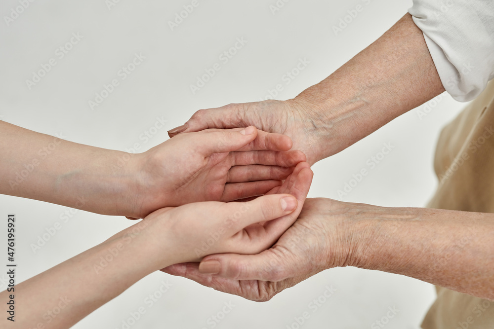 Granddaughter hands in hands of her grandma Granddaughter hands in hands of her grandma