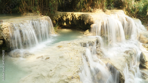 Kuang Si Waterfall and pools in tropical rain forest in Laos.