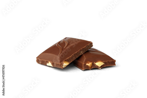 Pieces of chocolate with nuts isolated on white background.