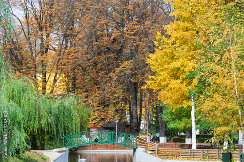 The lake from the Roman park in the autumn surrounded by colored trees, Romania