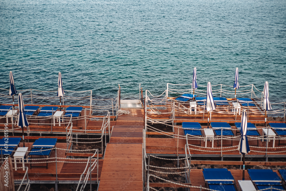 Fototapeta premium Santa Maria di Leuca, Italy-June 2021: deck chairs on the beautiful coastiline in the southern part of Puglia