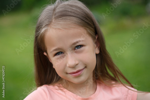 Portrait of a cute little girl in nature.