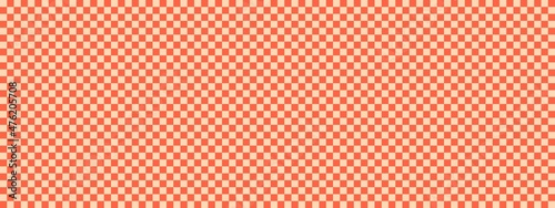 Checkerboard banner. Tomato and Apricot colors of checkerboard. Small squares, small cells. Chessboard, checkerboard texture. Squares pattern. Background.