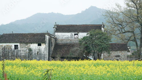 The  beautiful and old traditional Chinese village view with the mountains around it located in the countryside of the southern China 