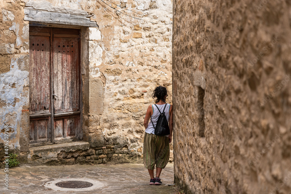 Traveler woman in a stone town