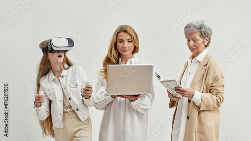 Three females with different items for leisure