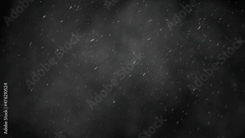 The footage of the snowfall on the dark background. photo