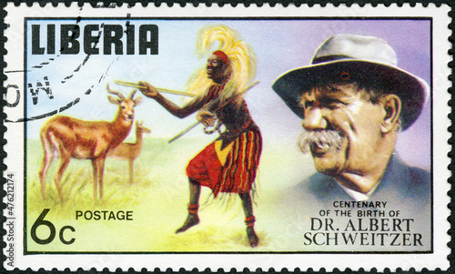LIBERIA - 1975: shows Antelope and dancer, series Dr. Albert Schweitzer (1875-1965), medical missionary, 100th anniversary of the birth, 1975 photo