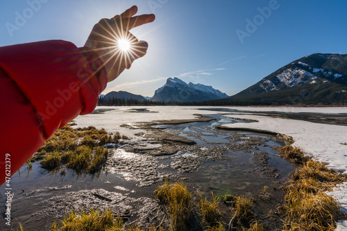 Fototapeta Naklejka Na Ścianę i Meble -  Catching sun winter sunrise over frozen Vermilion Lakes in Banff National