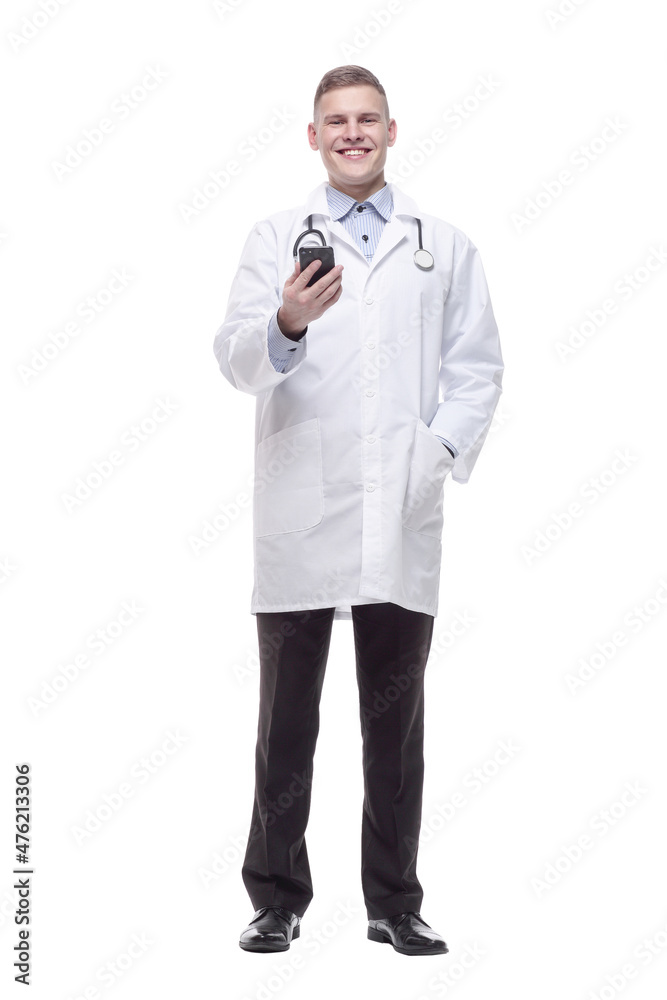 in full growth. young doctor with a smartphone. in full growth. young doctor with a smartphone.