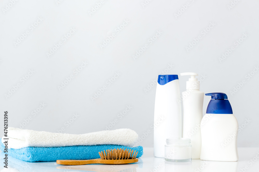 Hair care set of cosmetic products with shampoo and comb. Hair care set of cosmetic products with shampoo and comb.
