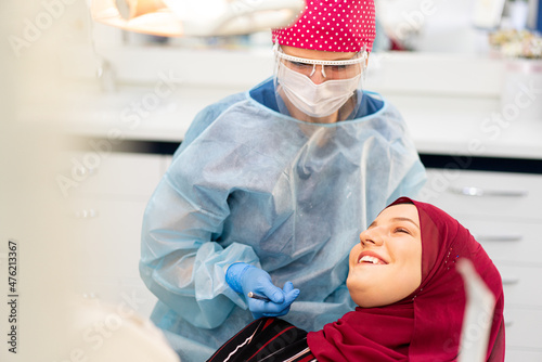 Photography Muslim Middle Eastern girl inside dentist office
