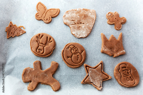 Gingerbread cookies on the baking paper for Christmas