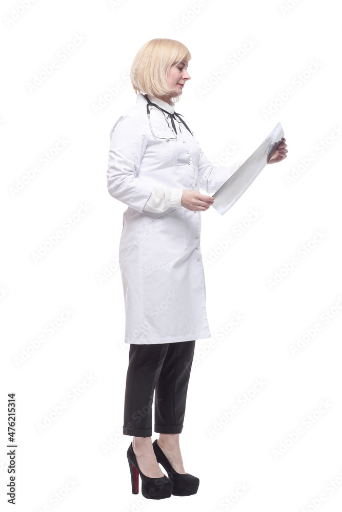 qualified female doctor looking at an x-ray . qualified female doctor looking at an x-ray .