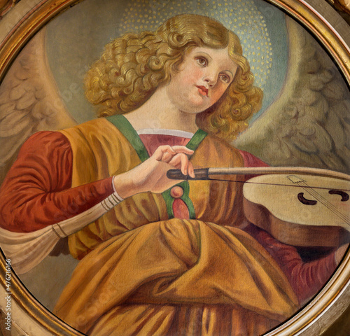 FORLÍ, ITALY - NOVEMBER 11, 2021: The fresco of angel with the violin in the Cattedrala di Santa Croce by Giovanni Secchi (1876 - 1950). photo