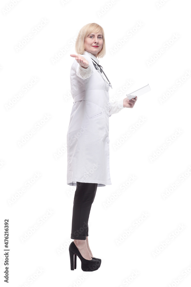 in full growth. qualified female doctor with a digital tablet. in full growth. qualified female doctor with a digital tablet.