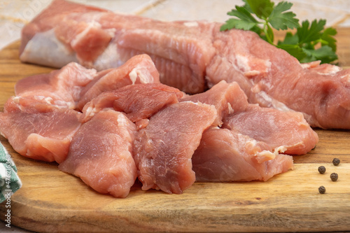 raw pork tenderloin on a cutting board
