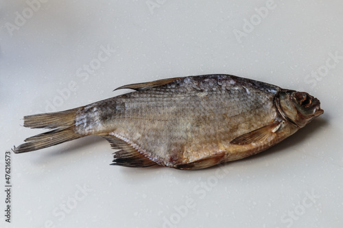 Dried salted fish close-up on white background.