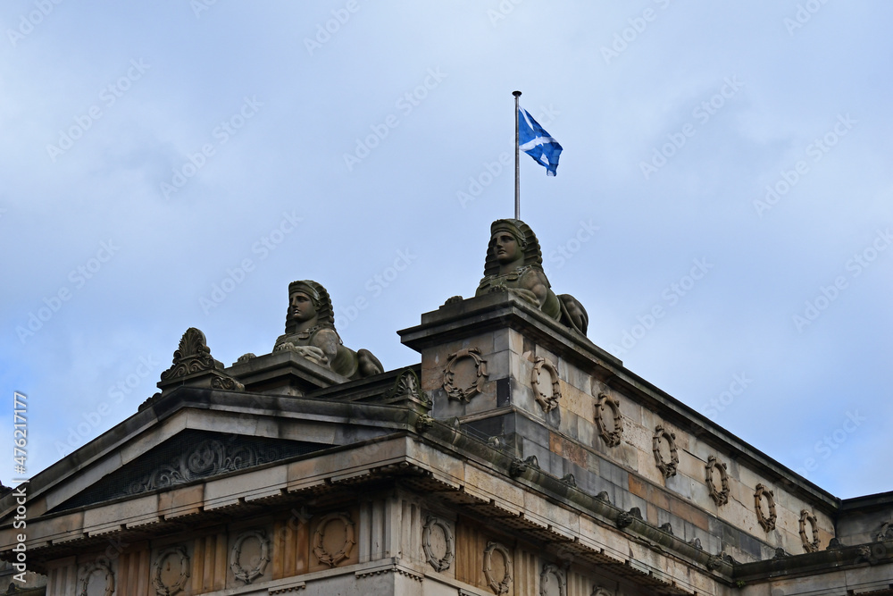 National Flag Flying above Classical Stone Building with Pediment 