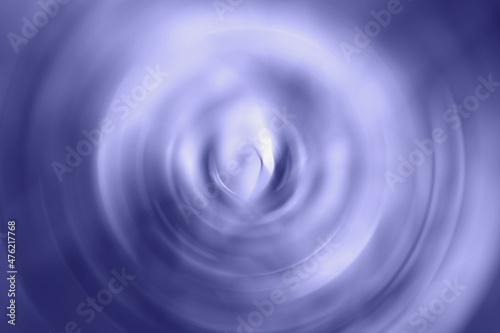 Trendy very peri color concept of the year 2022, violet blue, lavender blurred gradient radial motion background. Circular texture