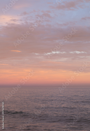 Orange, pink and lilac sunset sky in the sea.  © Esther Pueyo