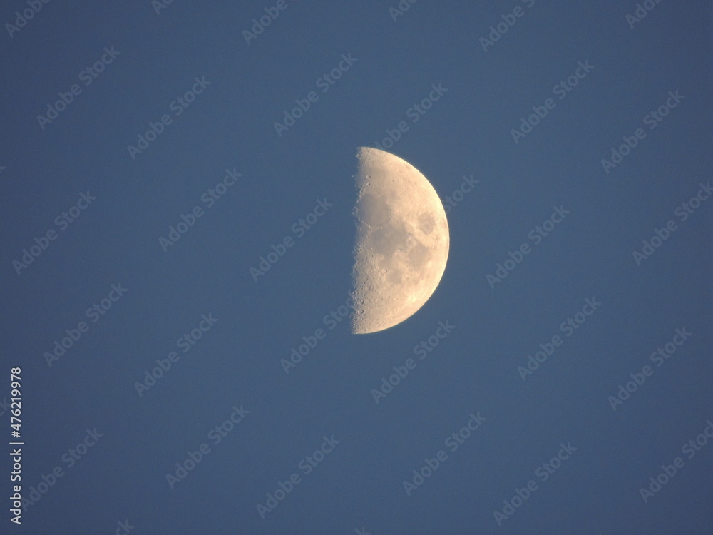 The moon on a blue background (sky). Macro photography with a zoom lens. The moon on a blue background (sky). Macro photography with a zoom lens.