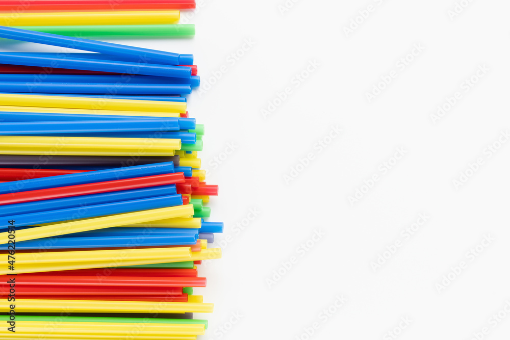 Pack of colorful plastic straws on white background. Recycle, environment conversation, pollution and plastic recycle concept. Copy space