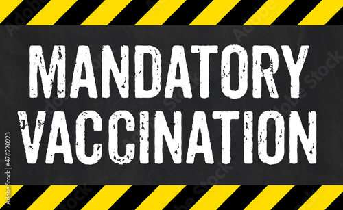 Sign with caution stripes - Mandatory vaccination