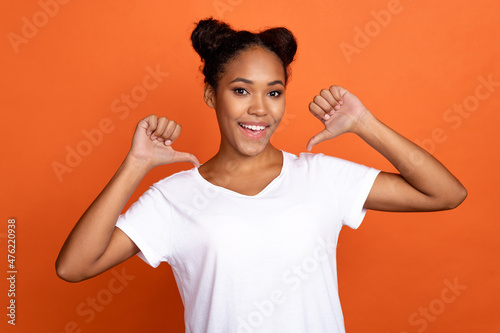 Photo of young lovely african woman point herself thumbs choice choose isolated over orange color background