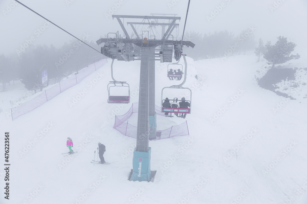 snowboarder is jumping with snowboard from snowhill. Skier skiing downhill in high mountains. Flying skier on mountains, winter extreme sport. snowboarder is jumping with snowboard from snowhill. Skier skiing downhill in high mountains. Flying skier on mountains, winter extreme sport.