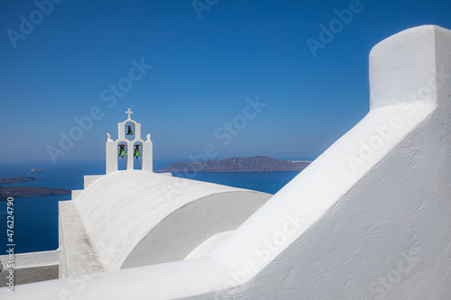 Greek orthodox church with blue dome by the sea in Oia small town in Santorini island  Greece. Travel landscape  summer tourism minimal scenic view  blue sea background. Idyllic religious architecture