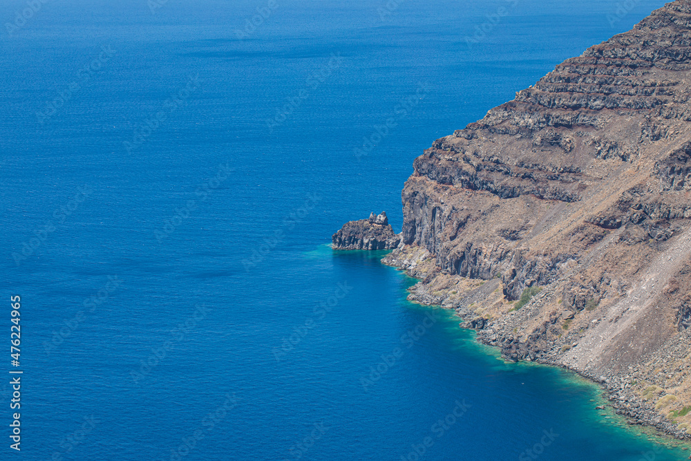 Aerial view of sea waves and fantastic rocky coast, high cliffs with calm sea bay. Nature landscape view with copy space, simplicity. Calmness, relaxation natural shore, coastal environment