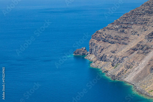 Aerial view of sea waves and fantastic rocky coast, high cliffs with calm sea bay. Nature landscape view with copy space, simplicity. Calmness, relaxation natural shore, coastal environment